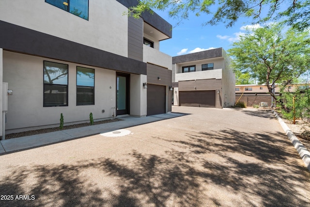 3010 N 37th St Unit 6, Phoenix, AZ 85018 - view of front of house featuring concrete driveway, a garage, and stucco siding