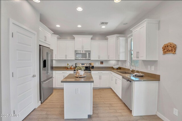 242 N Crosscreek Dr, Chandler, AZ 85225 - kitchen featuring stainless steel appliances, a sink, white cabinets, and recessed lighting