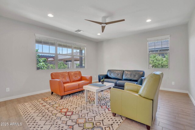 242 N Crosscreek Dr, Chandler, AZ 85225 - living room with plenty of natural light, light wood finished floors, ceiling fan, baseboards, and recessed lighting