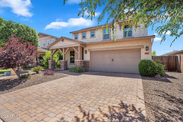 242 N Crosscreek Dr, Chandler, AZ 85225 - view of front facade featuring decorative driveway, stucco siding, a garage, and stone siding