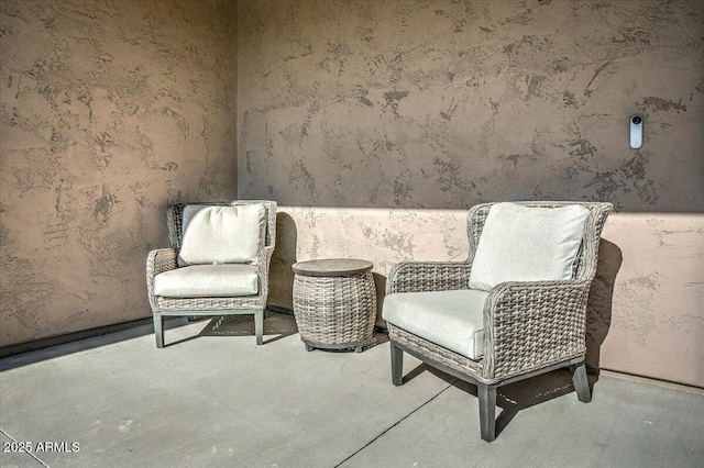 living area with concrete floors