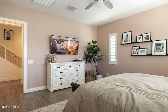 bedroom with dark wood-type flooring and ceiling fan