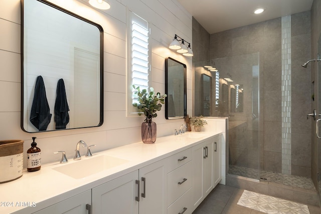 bathroom with vanity, tile patterned floors, and a shower with shower door