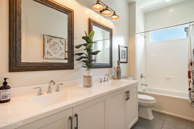 full bathroom featuring tile patterned flooring, toilet, vanity, and shower / bath combo with shower curtain