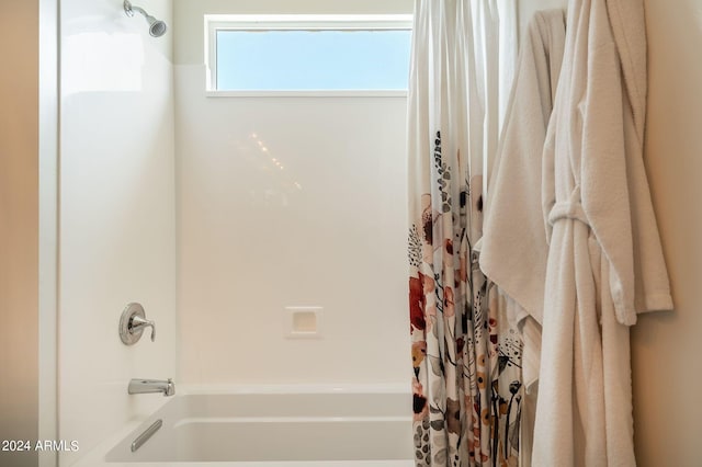 bathroom featuring shower / bath combo with shower curtain