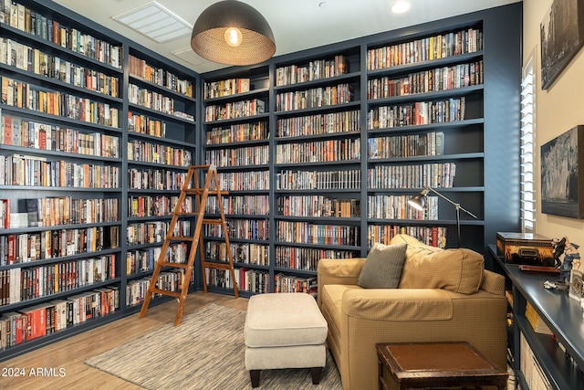 living area with hardwood / wood-style flooring