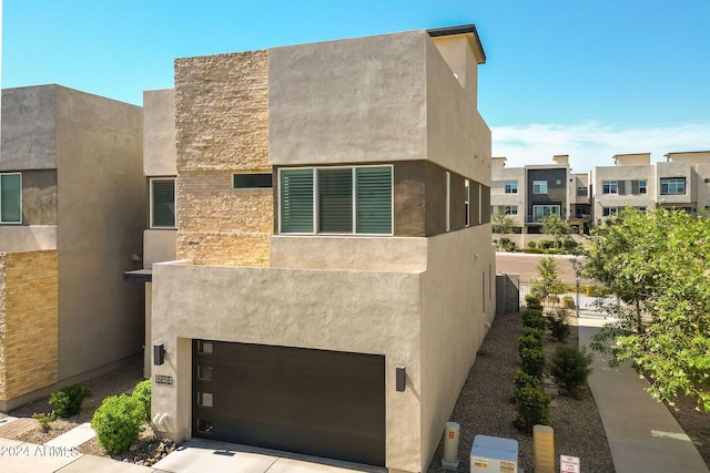 view of front of property with a garage