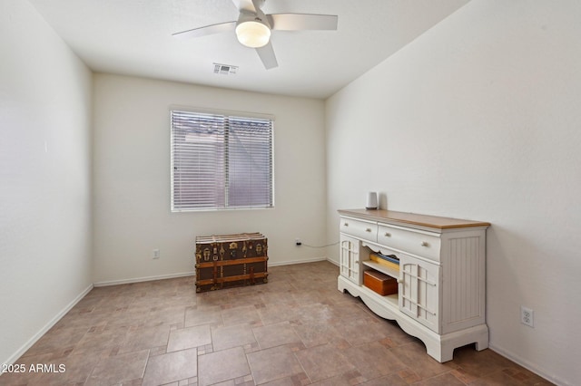 misc room featuring baseboards, visible vents, and a ceiling fan