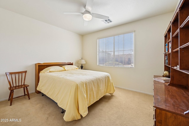 bedroom with visible vents, ceiling fan, light carpet, and baseboards