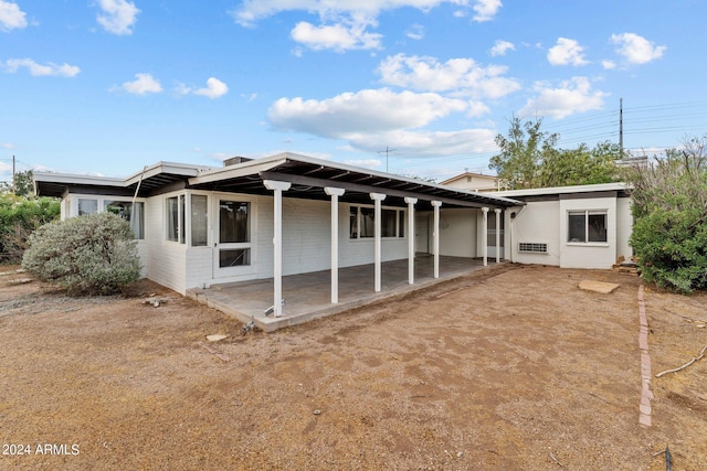 back of property featuring a patio area