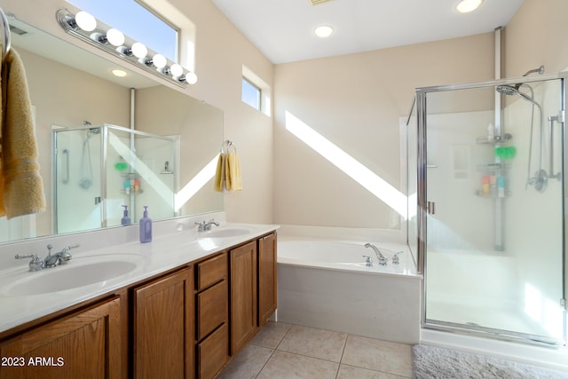 bathroom featuring vanity, independent shower and bath, and tile patterned flooring