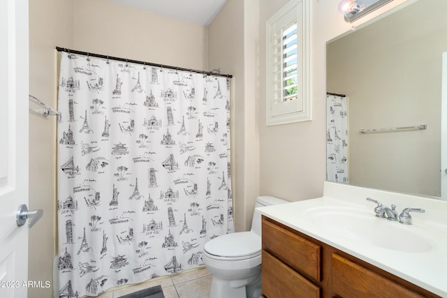 bathroom with vanity, a shower with curtain, toilet, and tile patterned floors