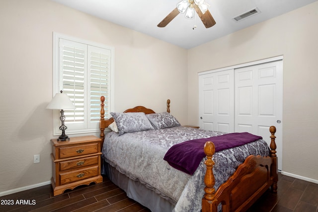 bedroom featuring a closet, ceiling fan, and dark hardwood / wood-style flooring