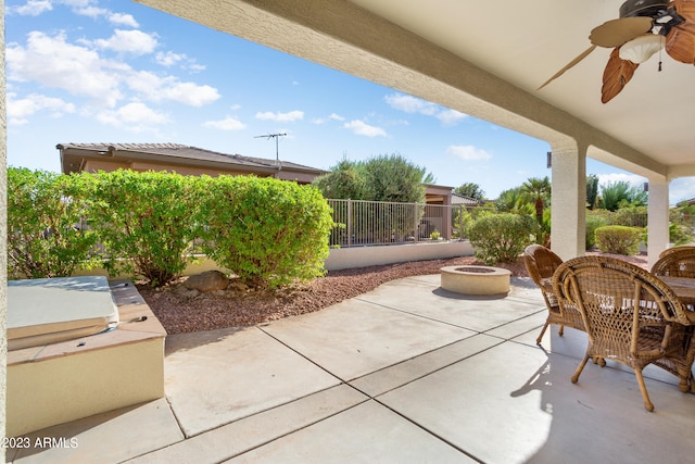 view of patio / terrace featuring an outdoor fire pit and ceiling fan