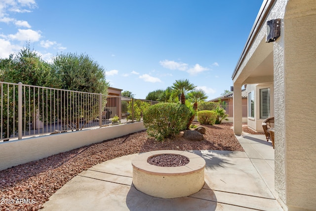 view of patio with an outdoor fire pit