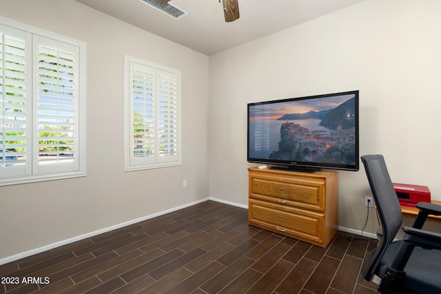 home office featuring ceiling fan and dark hardwood / wood-style flooring