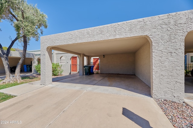 exterior space with a carport