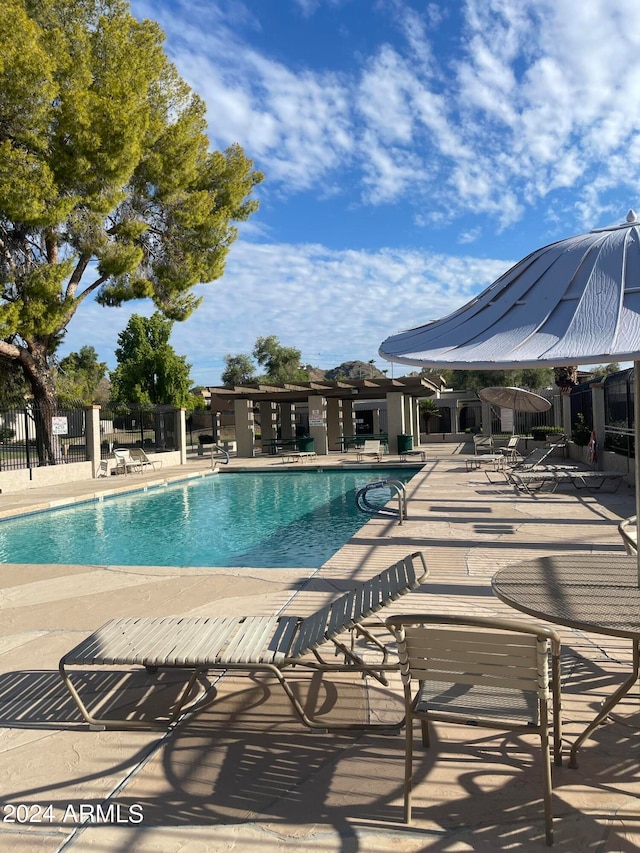 view of swimming pool featuring a patio