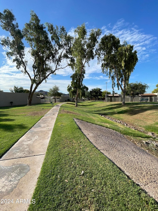 view of home's community featuring a lawn