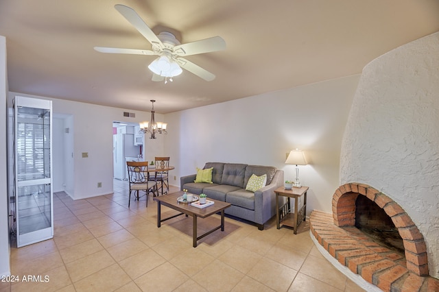 living room featuring ceiling fan with notable chandelier