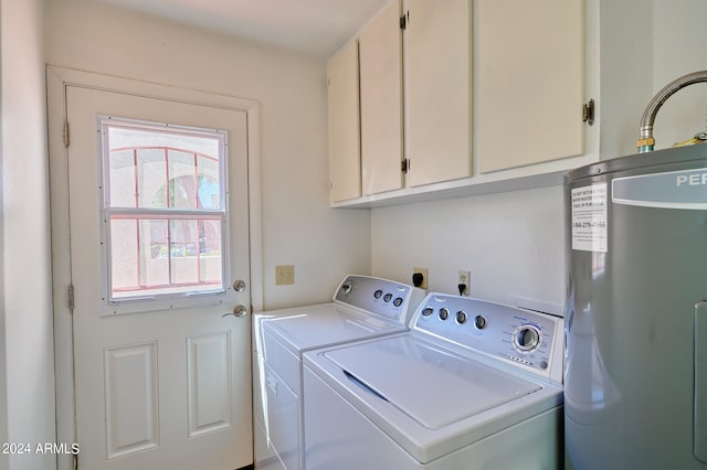 washroom featuring cabinets, separate washer and dryer, and water heater