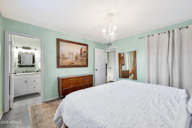 bedroom with sink, connected bathroom, and a chandelier