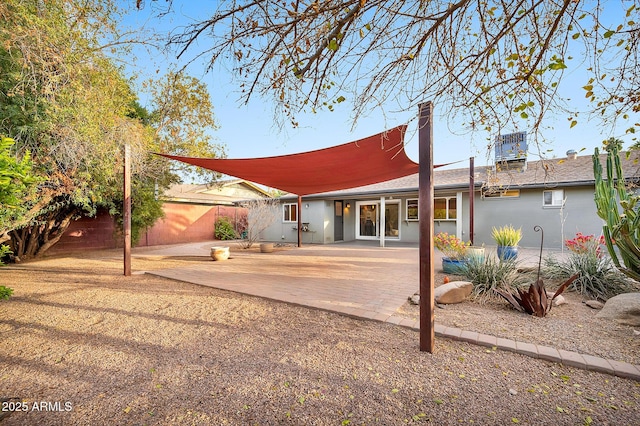 rear view of property featuring a patio area