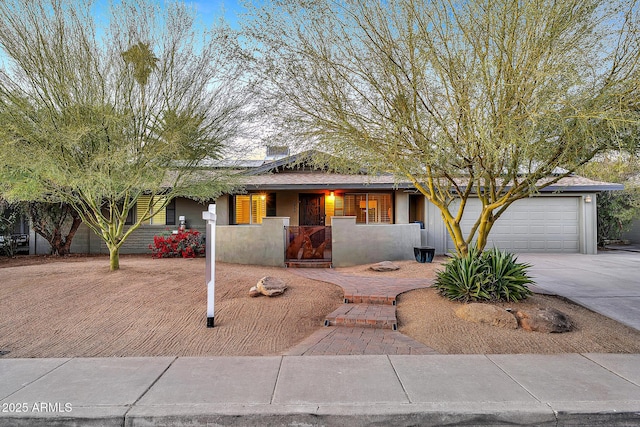 view of front of home with a garage