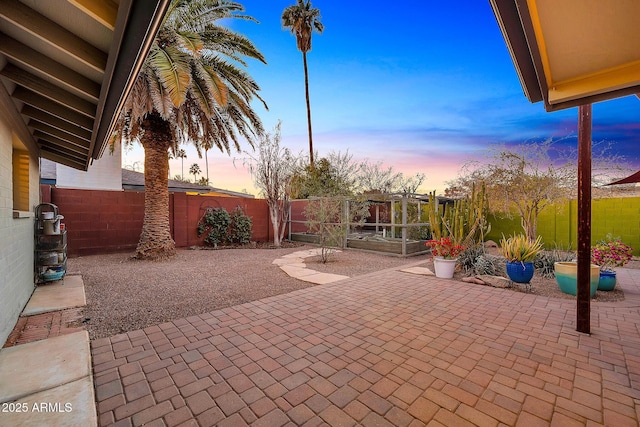 view of patio terrace at dusk