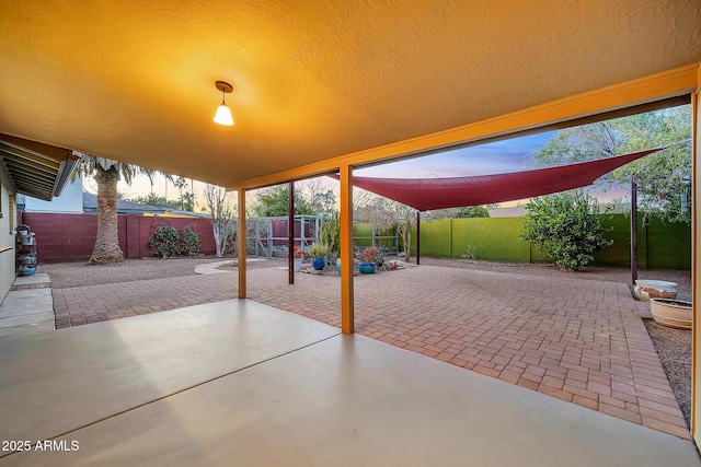 view of patio terrace at dusk