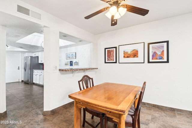 dining space with ceiling fan