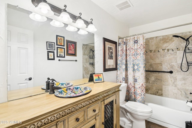 full bathroom featuring shower / tub combo with curtain, vanity, and toilet