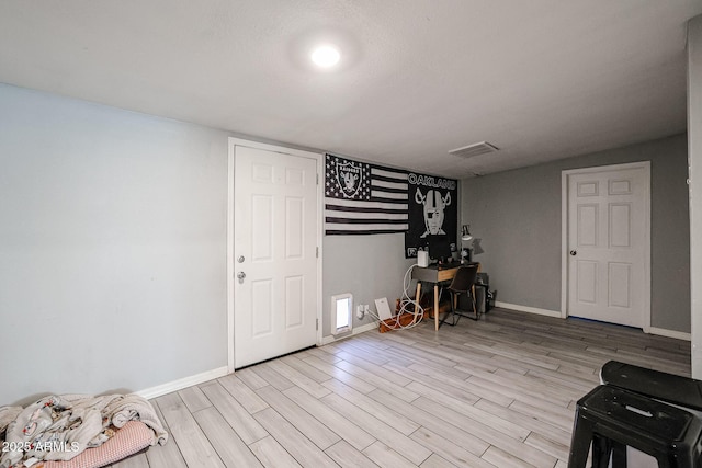 entrance foyer featuring light hardwood / wood-style floors