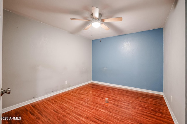 unfurnished room featuring ceiling fan and hardwood / wood-style floors