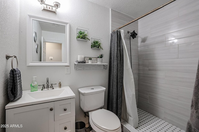 bathroom with curtained shower, vanity, a textured ceiling, and toilet