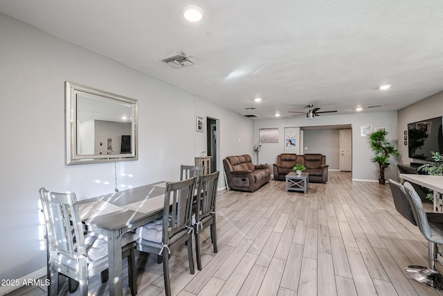 dining room featuring ceiling fan and light wood-type flooring