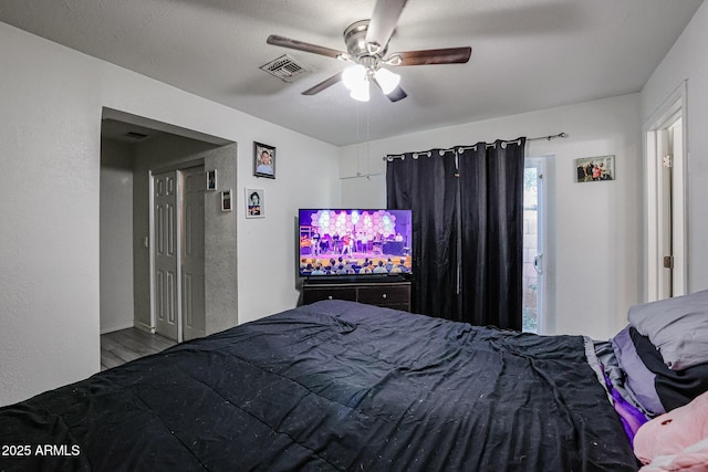 unfurnished bedroom featuring wood-type flooring and ceiling fan