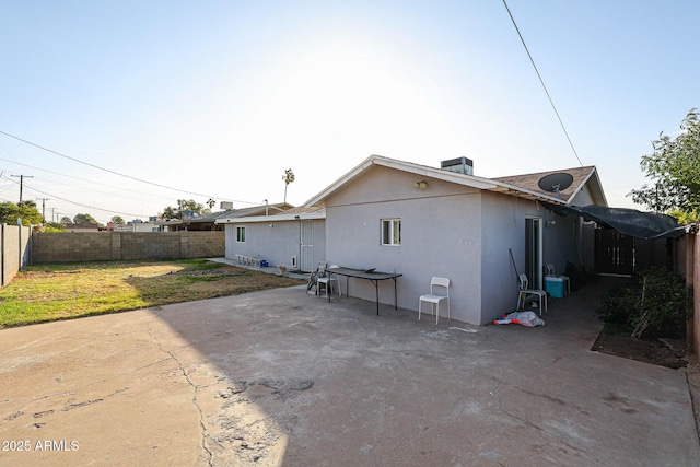 back of house with a patio, cooling unit, and a lawn