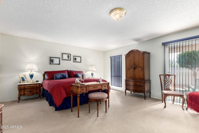 carpeted bedroom featuring a textured ceiling