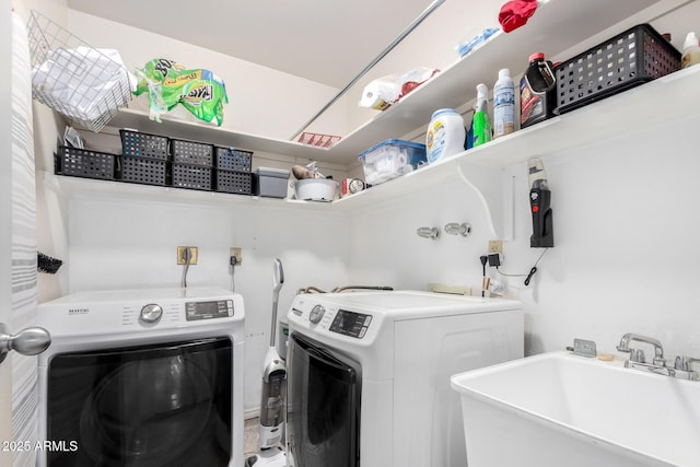 washroom featuring washer and clothes dryer and sink