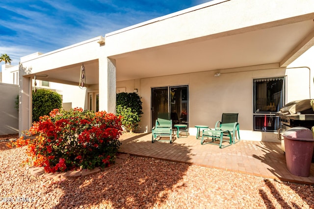 rear view of house featuring a patio area