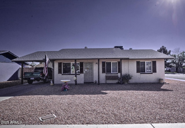 single story home featuring a carport