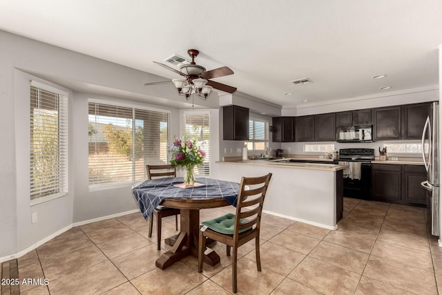 dining space featuring light tile patterned floors and ceiling fan