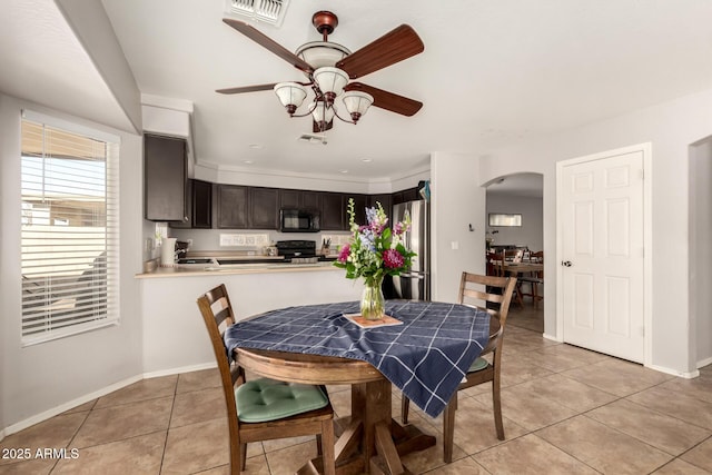 dining room with ceiling fan and light tile patterned floors