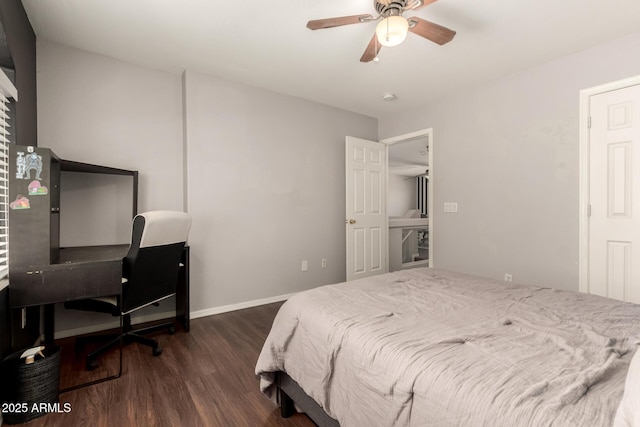 bedroom with dark hardwood / wood-style floors and ceiling fan