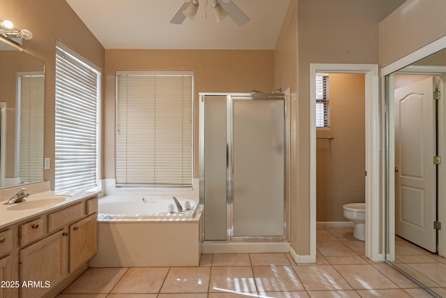 full bathroom with tile patterned floors, vanity, toilet, and independent shower and bath