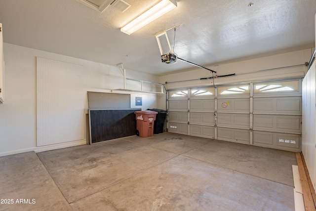 garage featuring electric panel and a garage door opener