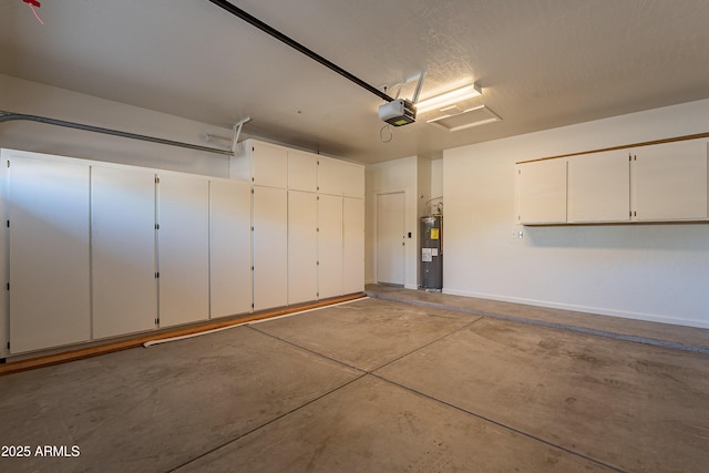 garage with a garage door opener and water heater