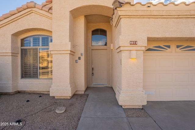 doorway to property featuring a garage