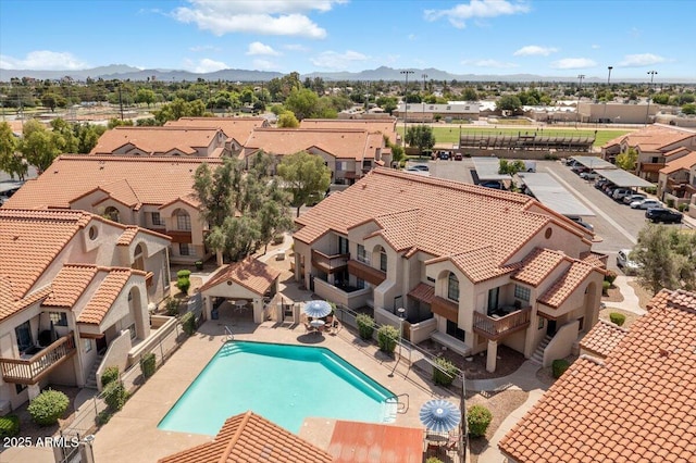 839 S Westwood Unit 154, Mesa, AZ 85210 - aerial perspective of suburban area featuring a pool and a mountain backdrop